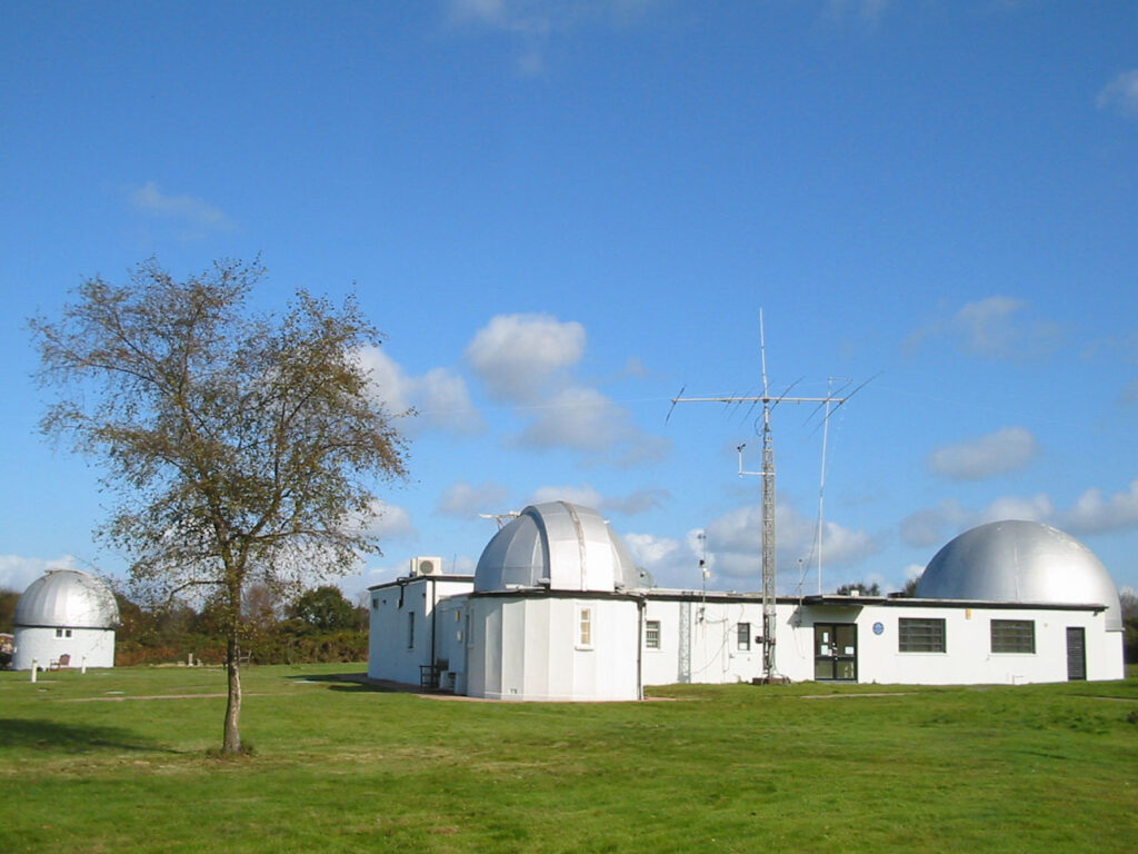 Norman Lockyer Observatory view of white building and grey domed roofs